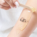 Can you wax over a tattoo