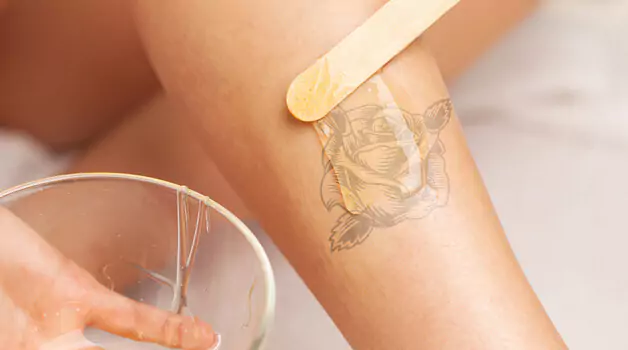 Can you wax over tattooed skin