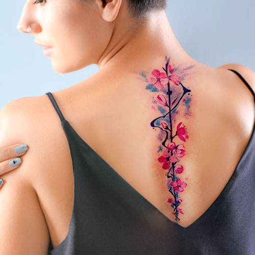 Colored spine tattoo