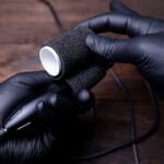 Why do artists wrap their tattoo machine