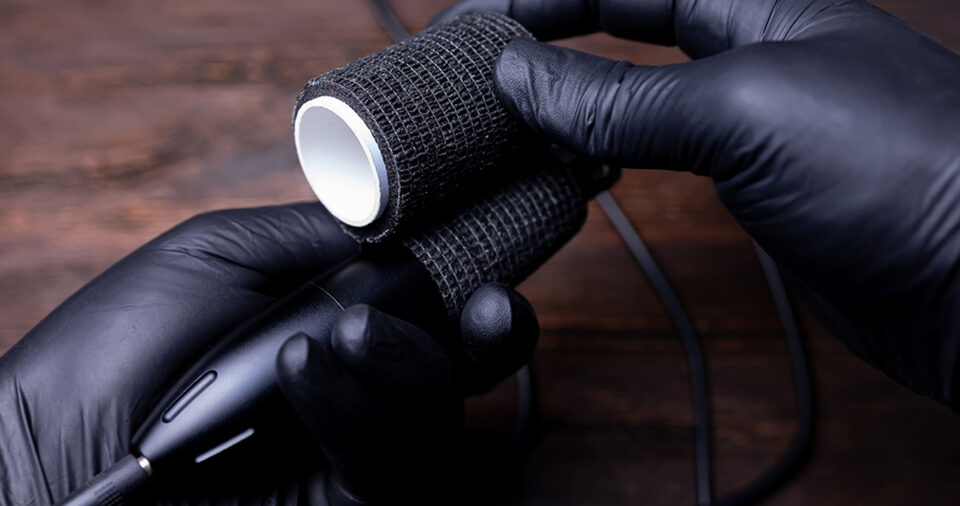 Why do artists wrap their tattoo machine