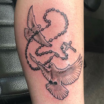 Dove cross tattoo