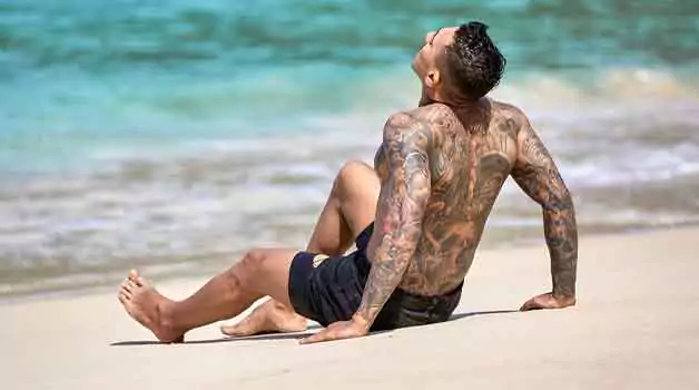 Getting a sunburn on your tattoo Ways to fix it