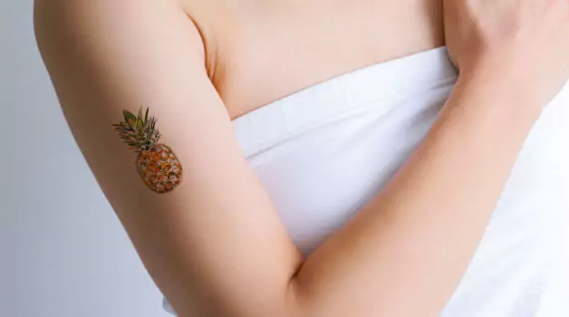 Origin, meaning & history of pineapple tattoo