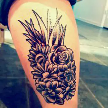 Pineapple with tropical flowers