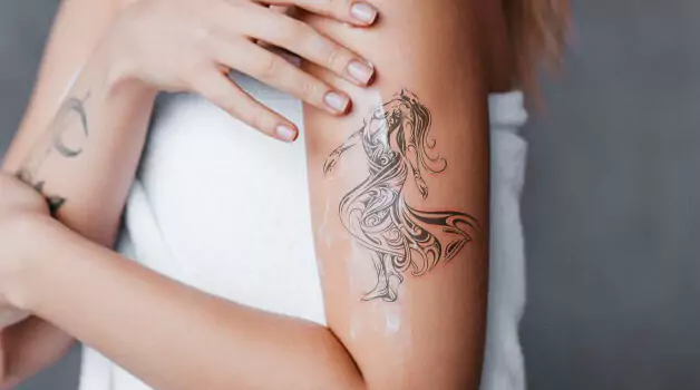 Can I put tanning lotion on my new tattoo