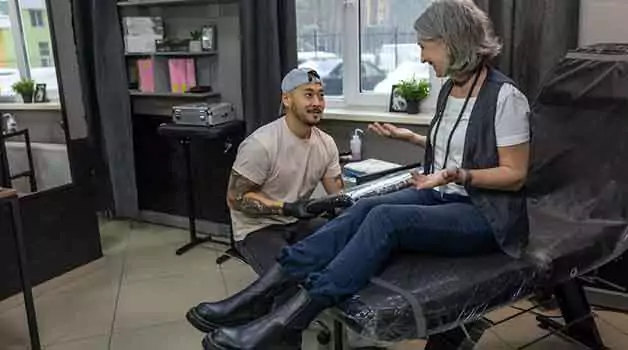 Gap between tattoo sessions if you have std