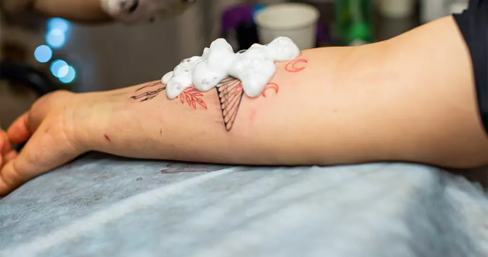 When can I stop washing my tattoo