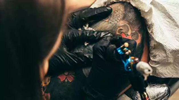 Adding color to a black tattoo