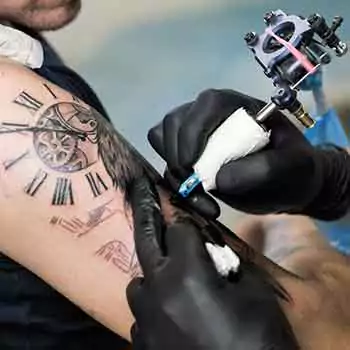 Adding color while making a black tattoo