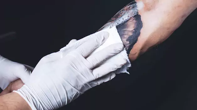 How to remove sticky residue from tattoo bandages