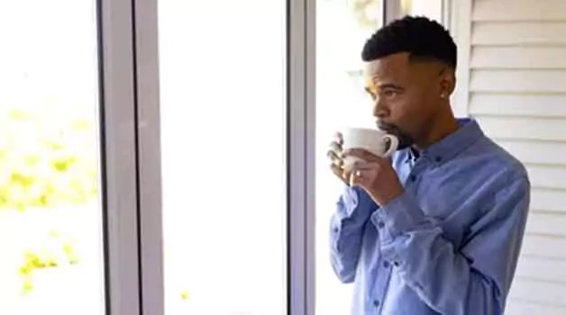 Drinking coffee before getting a tattoo