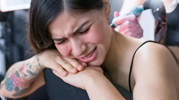 Pain level of behind the ear tattoos