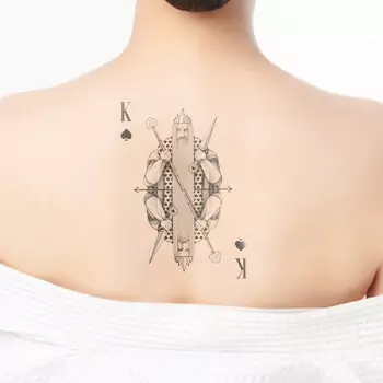 Geometric King of Spades tattoo