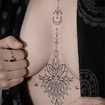 Mandala sternum tattoo