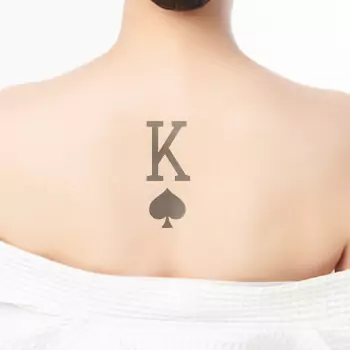 Matching king & queen of spades tattoo