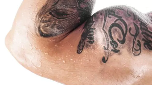 Precautions to consider while sweating with a new tattoo
