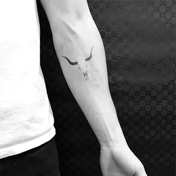 Simple bull skull tattoo design forearm