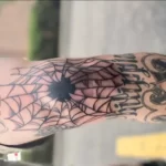 Spider web on elbow meaning