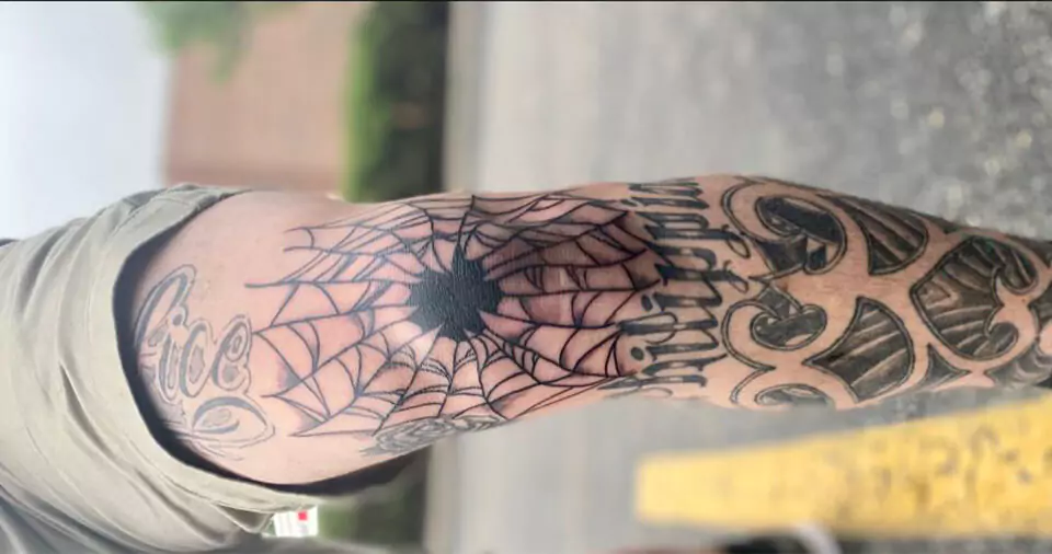 Spider web on elbow meaning