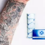 Can you put saniderm on a scabbed tattoo