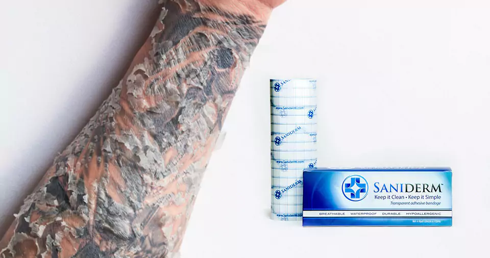 Can you put saniderm on a scabbed tattoo