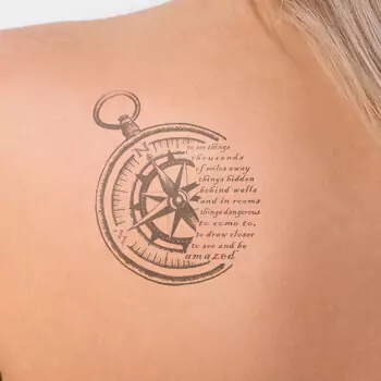 Compass and quote tattoo
