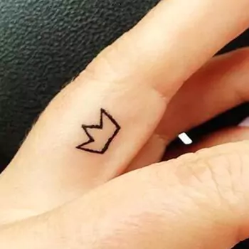 Crown finger tattoo
