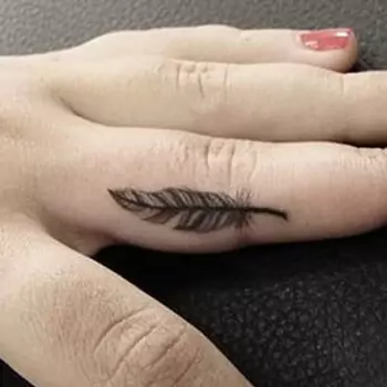Feather finger tattoo