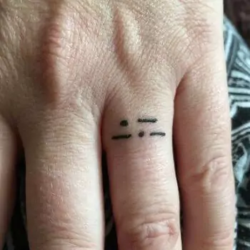 Initials finger tattoo
