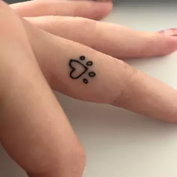 Paw print finger tattoo