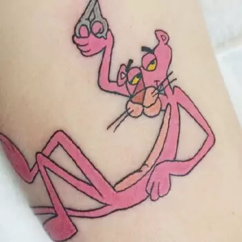 Pink panther with a playful expression tattoo