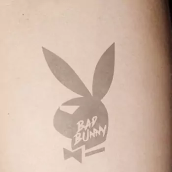 Playboy bunny tattoo with inscription