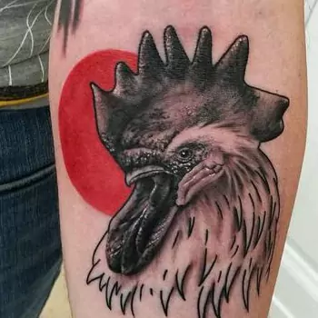 Rooster and sun tattoo