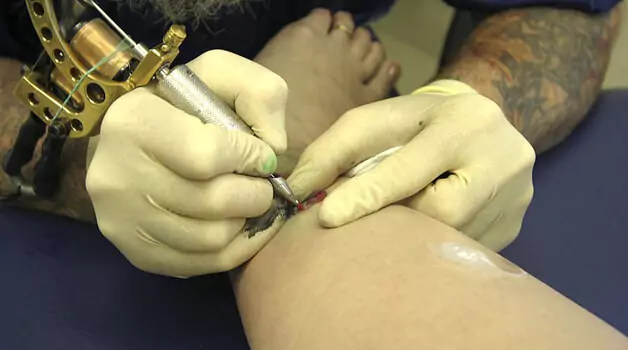Steps to make ankle tattoo less painful