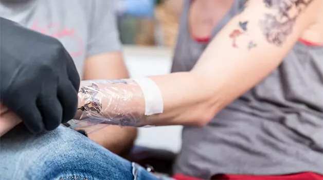 Tegaderm on a week old tattoo: What happens