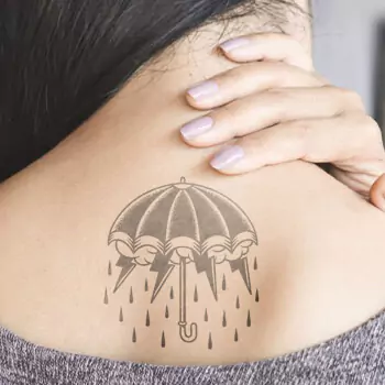 Umbrella with storm underneath tattoo