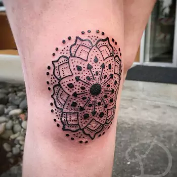 Geometric mandala on kneecap tattoo
