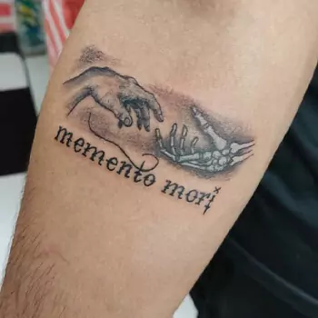 Hand and skeleton with Memento Mori tattoo