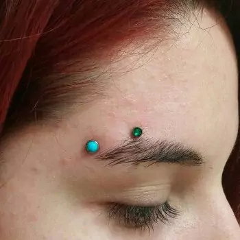 Horizontal eyebrow piercing