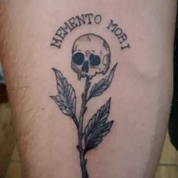 Memento Mori with a skull with a flower tattoo