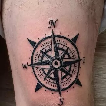 Rose compass on the kneecap tattoo
