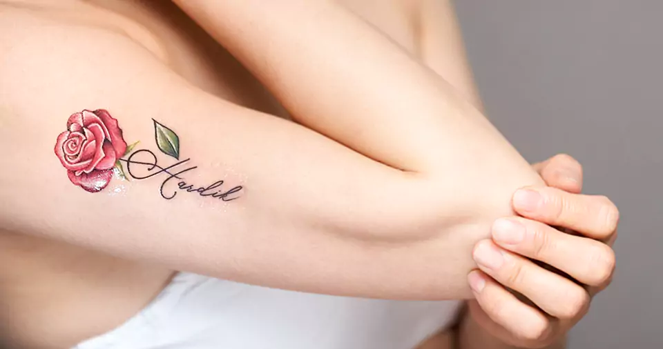 Rose tattoo with name