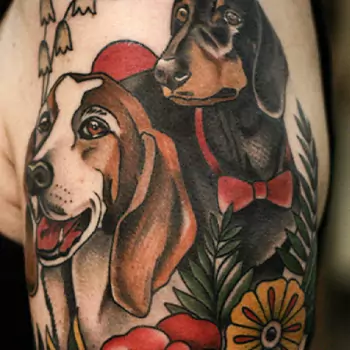 Rose tattoo with two animals and a name