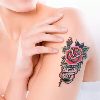 Traditional rose tattoo with a name