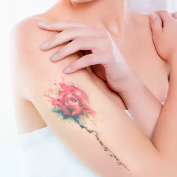 Watercolor rose tattoo with a name